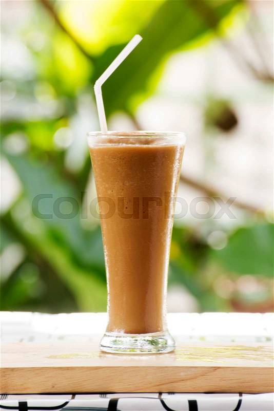 Glass of Thai Coffee smoothie on the table, stock photo