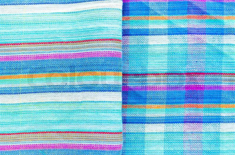 Colorful line patterned fabrics blue green violet yellow texture background, stock photo
