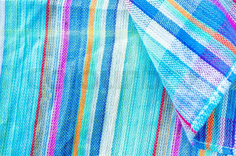 Colorful line patterned fabrics blue green violet yellow texture background, stock photo