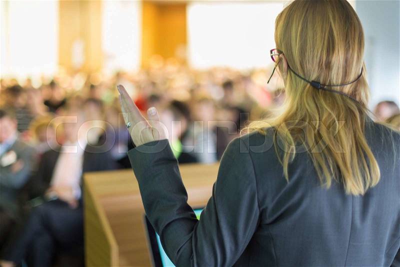 Female speaker at Business Conference and Presentation. Audience at the conference hall. Business and Entrepreneurship. Business woman, stock photo