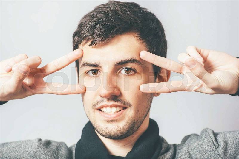 Man showing two fingers, stock photo