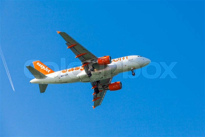 FARO,PORTUGAL-MAY 09:EasyJet Airline Airbus A319 arrives to the Faro International Airport, May 09, 2015 in Faro, Portugal. Easyjet had 145 A319\'s in service, stock photo