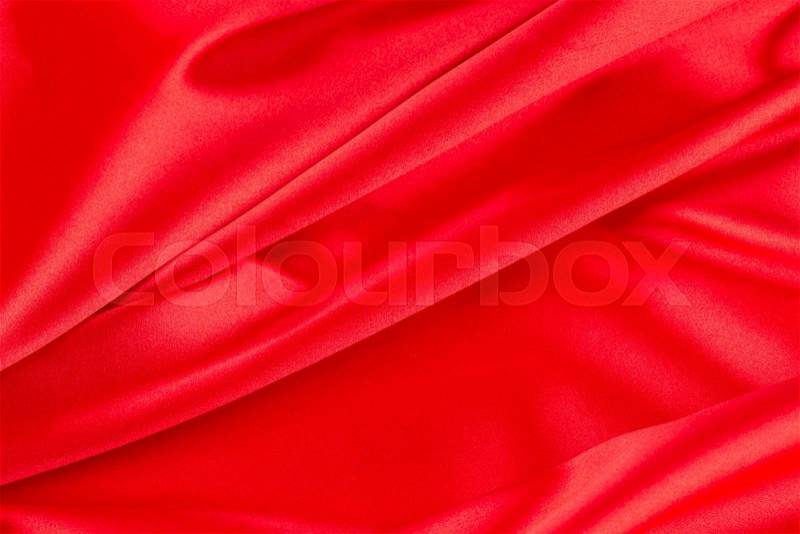 Red silk drapery. Close up on the whole background, stock photo