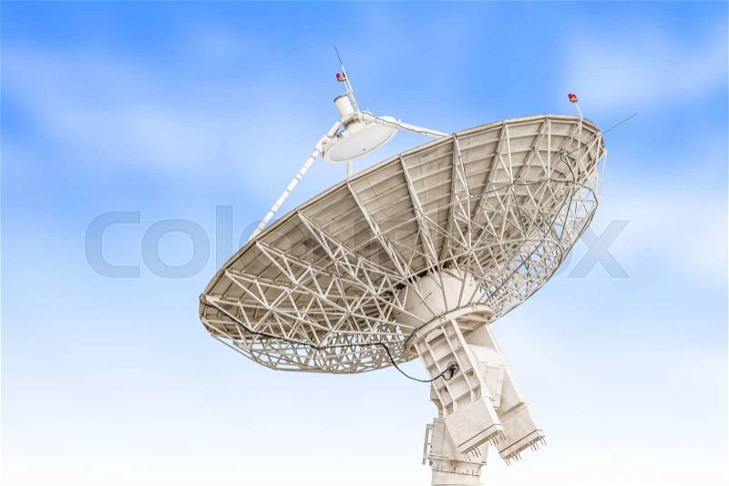 Satellite dish antenna radar big size isolated on blue sky background, stock photo
