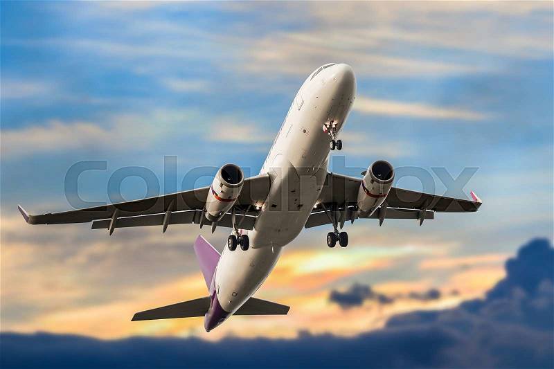 Passenger business airplane take off and flying in blue sky sunset, use for air transport, journey and travel concept, stock photo