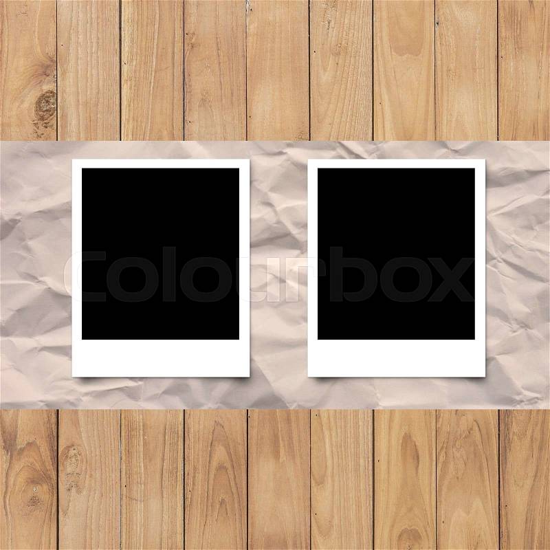 Blank photo frame on White paper on wood planks texture background wallpaper, stock photo