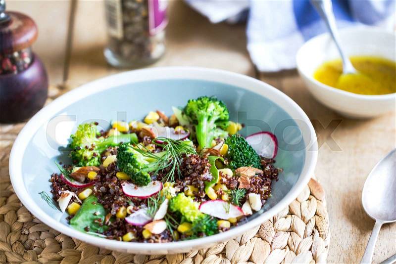 Red Quinoa with corn and broccoli salad by vinaigrette, stock photo