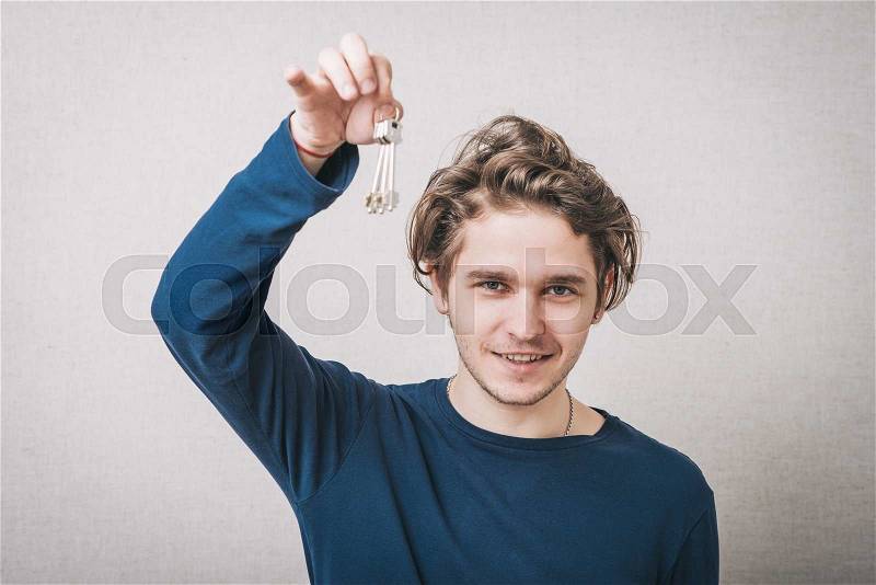 The man with key in hand, stock photo