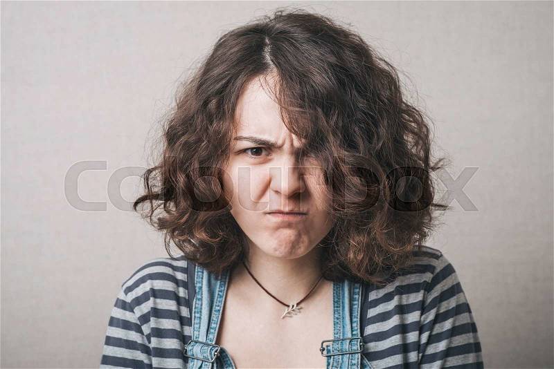 Portrait of disgusted woman, stock photo
