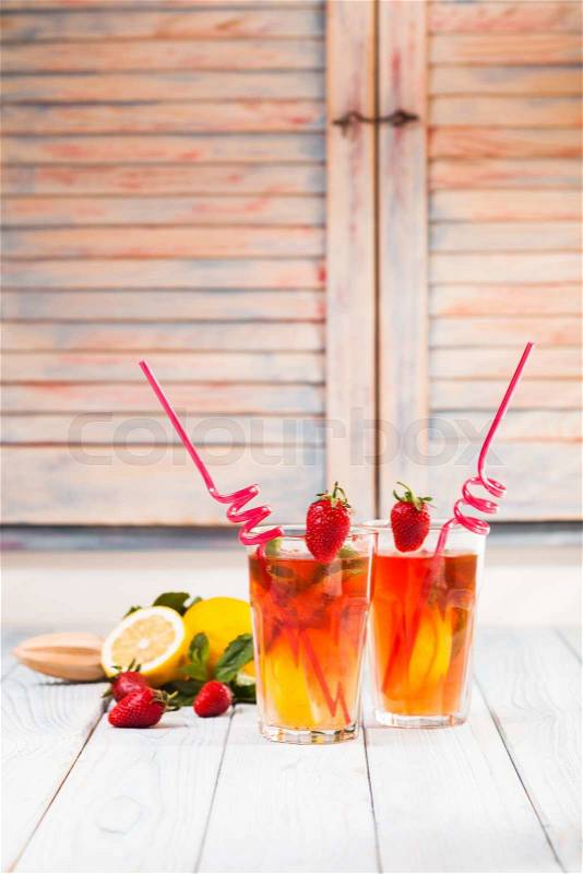 Lemonade with a strawberry, lemon and mint, stock photo