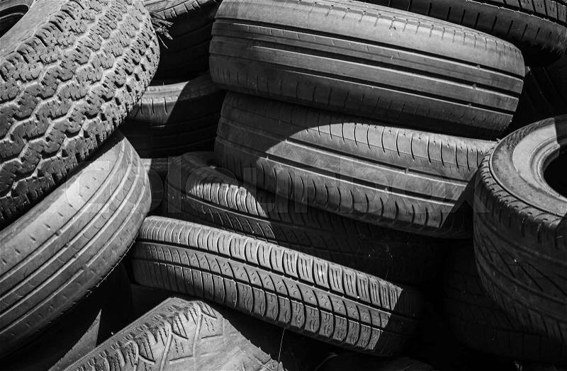 Heap of old used worn-out car tires, stock photo