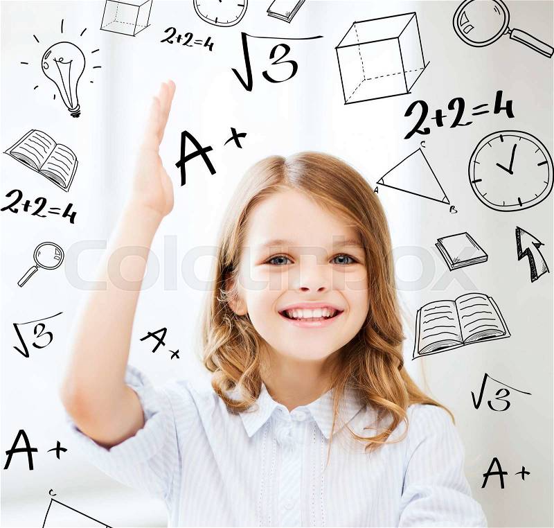 Education and school concept - little student girl studying and raising hand at school, stock photo