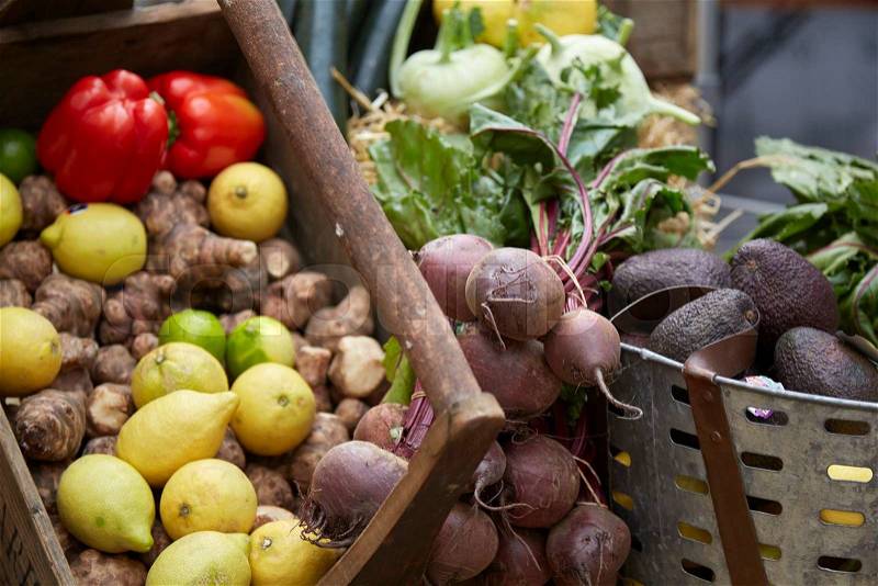 Fruit and vegetables in a basket at a farmers market, stock photo