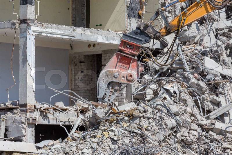 Pieces of Metal and Stone are Crumbling from Demolished, stock photo