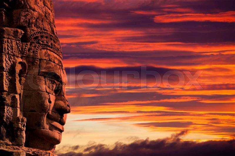 Profile face sculpture of king Jayavarman VII (others believe it\'s the bodhisattva of compassion called Avalokitesvara or Lokesvara) at The Bayon Temple, Angkor Wat, Combodia, stock photo