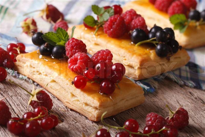 Homemade berry pastry with honey and mint on a table macro. horizontal , stock photo