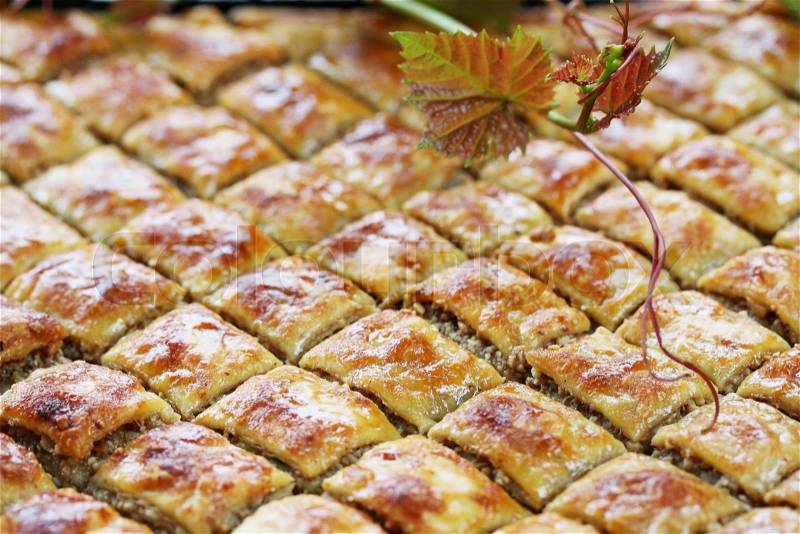 Eastern sweets, baklava stuffed with nuts and honey, stock photo