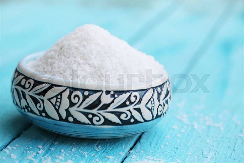 sea salt in a turquoise bowl with a pattern, stock photo