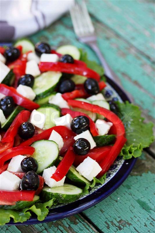 Greek salad with feta cheese, olives and vegetables, stock photo