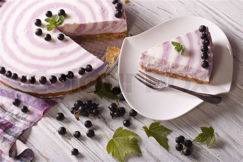 Beautiful cheese cake with currants close-up on the table. horizontal view from above , stock photo
