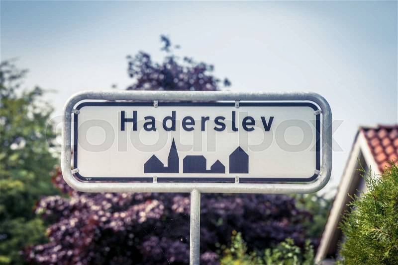 Danish city sign of Haderslev in the summer, stock photo