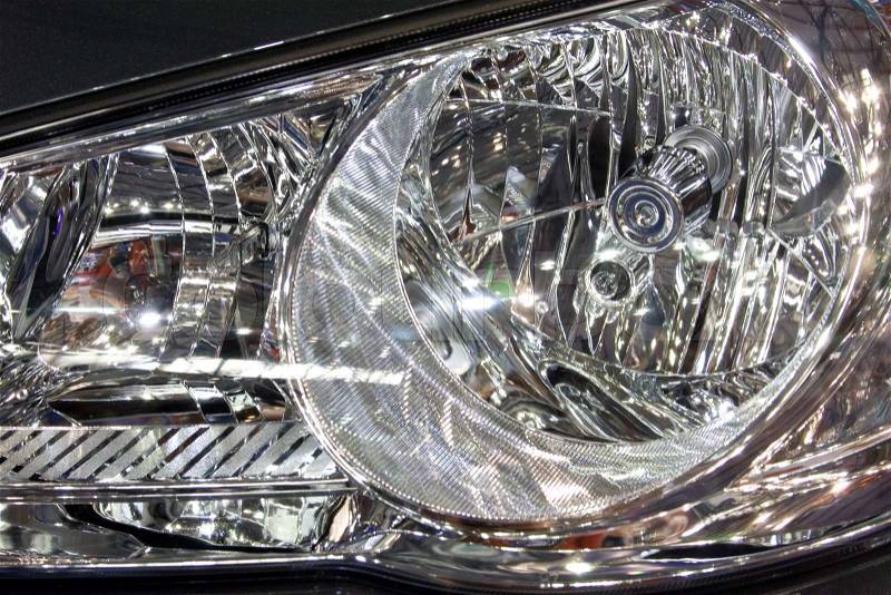 Close-up of a new modern car head lamp, stock photo