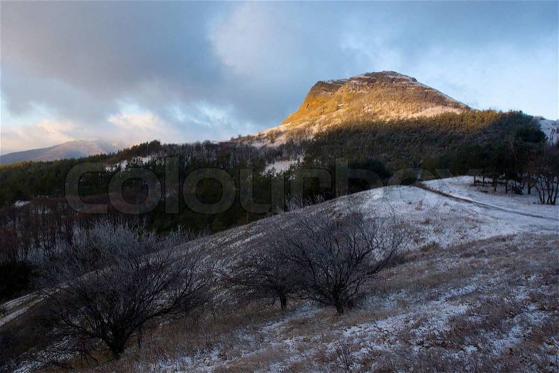 Winter Landscape of Crimea mountains, with high snow, light on the mountain, Ukraine, stock photo