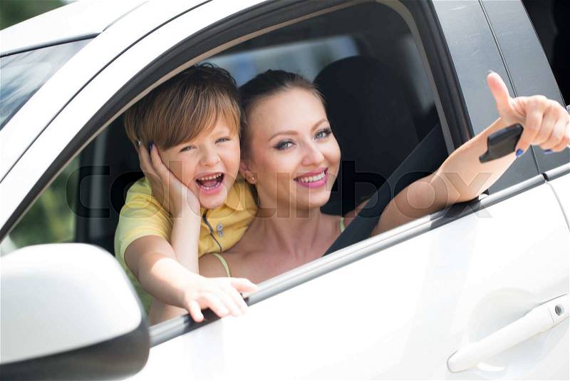Mother with son sitting in the car, stock photo