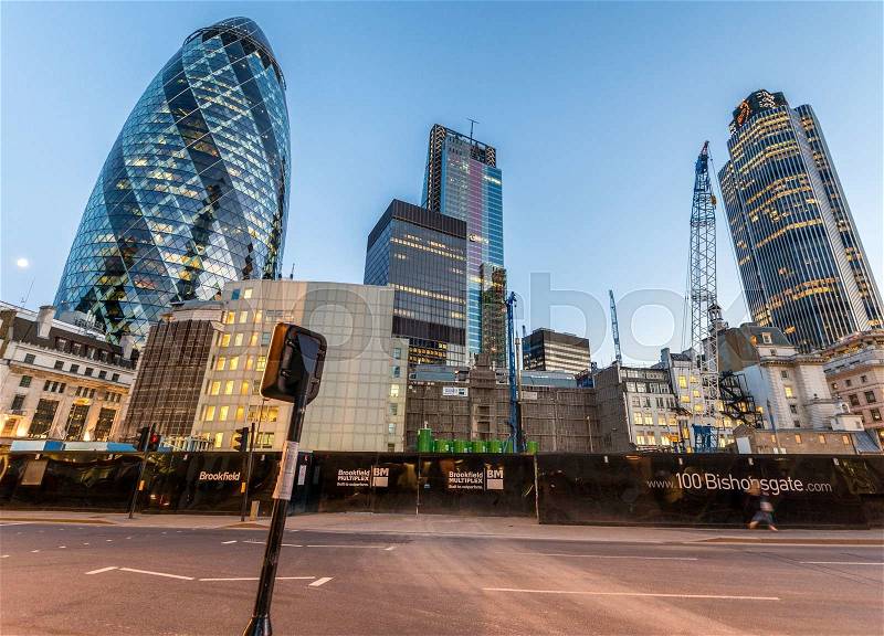LONDON - JUNE 13, 2015: The Gherkin at sunset. The building is a commercial skyscraper in London\'s primary financial district, the City of London, stock photo