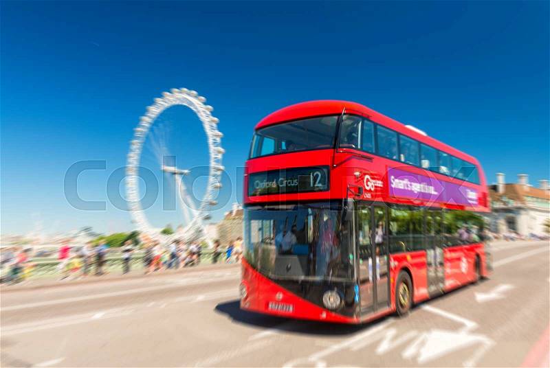 LONDON - JUNE 12, 2015: Fast moving red bus on Westminster Bridge. The London Bus service is one of the largest urban bus networks in the world with 8,000 buses covering 700 routes, stock photo