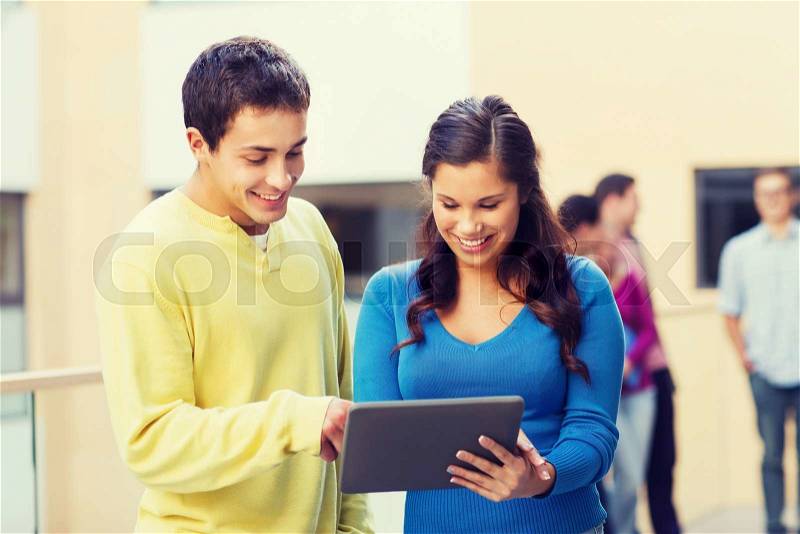 Friendship, people, technology and education concept - group of smiling students with tablet pc computer outdoors, stock photo