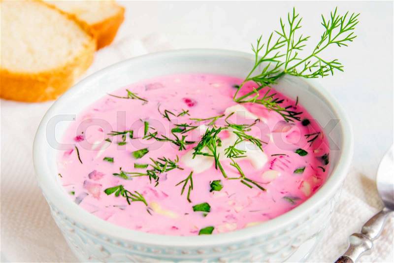 Cold soup with vegetables and herbs in bowl , stock photo