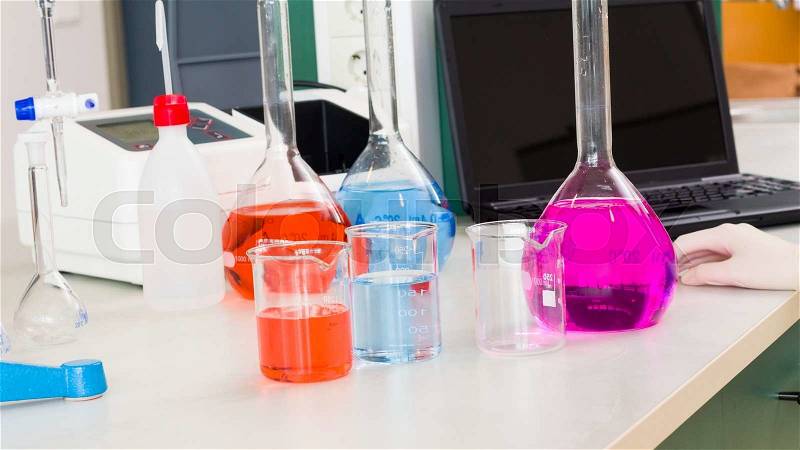 Pharmaceutical research at the laboratory with toxic liquid substances, stock photo