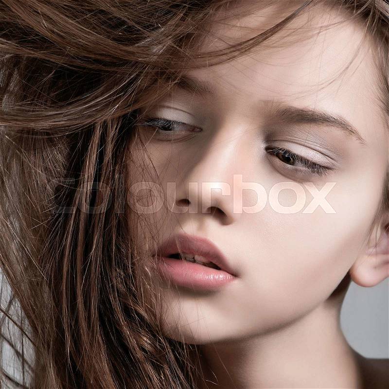 Fashion model with full lips. Close-up portrait, stock photo
