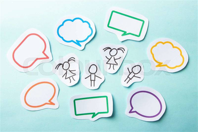 Paper people with colorful blank dialog speech bubbles. Social networking concept, stock photo