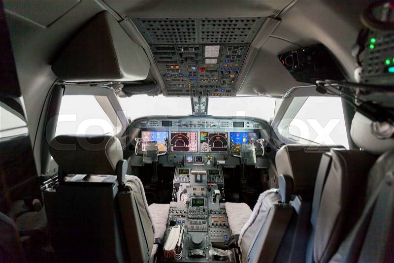 Inside view Cockpit G550 with blue sky and clouds, stock photo