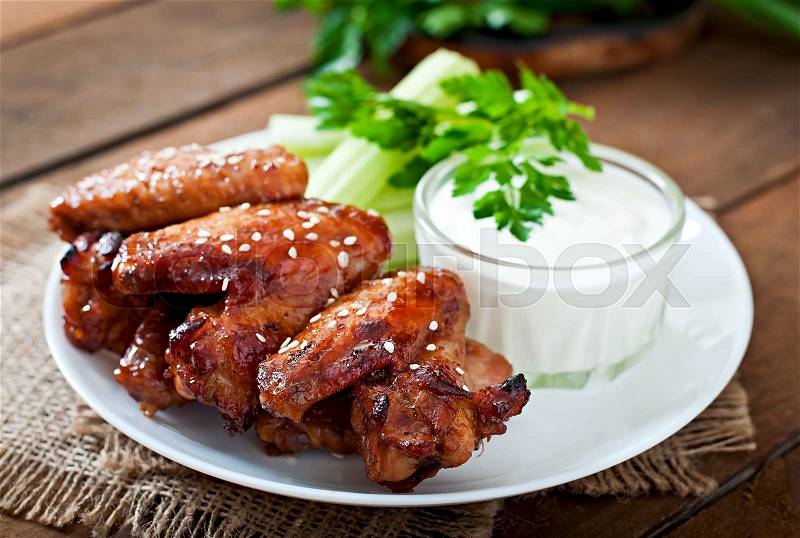 Baked chicken wings with teriyaki sauce, stock photo