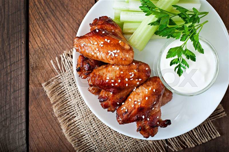 Baked chicken wings with teriyaki sauce, stock photo