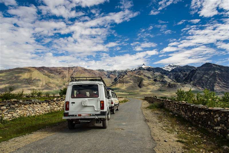 Jeep Caravan cars on road with View of Zanskar Valley around Padum villange and great himalayan range- Ladakh, Jammu and Kashmir, India, stock photo