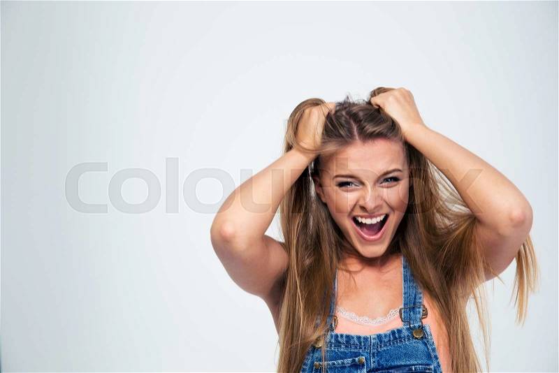 Portrait of a pretty young woman shouting isolated on a white background, stock photo
