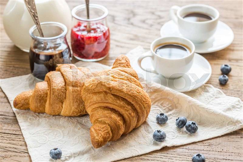 Croissants with cups of coffee and milk, stock photo