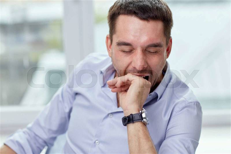 People and tiredness concept - yawning tired man at home or office, stock photo