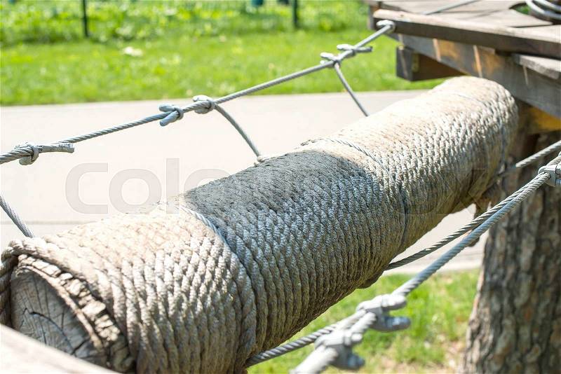 The bridge of logs tied to the ropes, part of a ropes course, stock photo