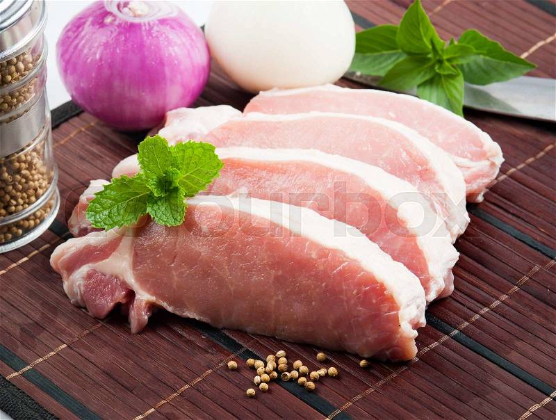 Meat, pork, slices pork loin on wood, stock photo