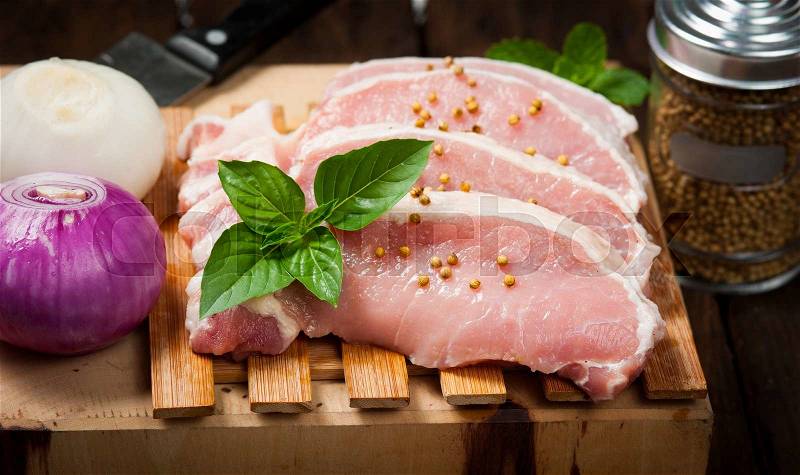 Meat, pork, slices pork loin on wood, stock photo