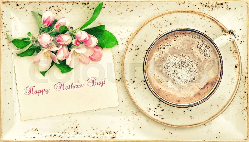 Hot chocolate with flowers and greetings card. Cocoa drink with milk foam. Happy Mother\'s Day! VIntage style toned picture, stock photo
