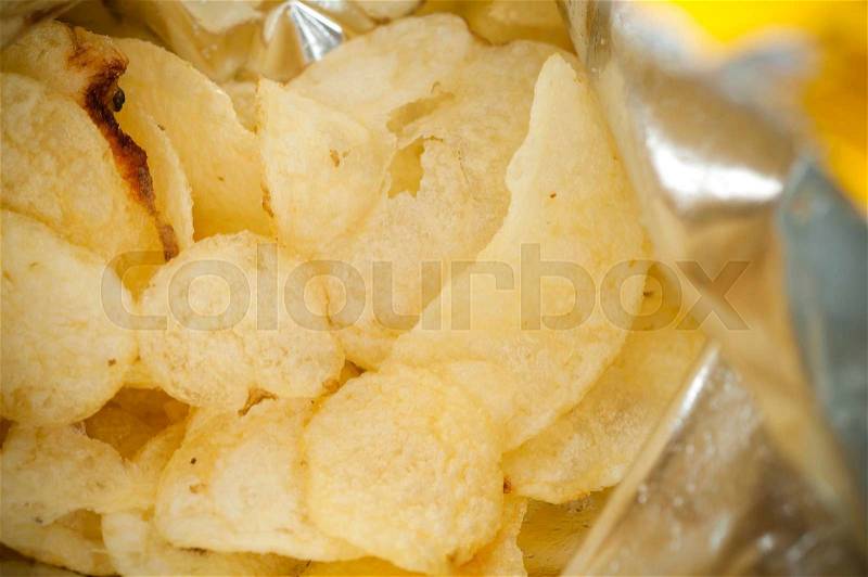 Inside bag of potato chips closed up, stock photo
