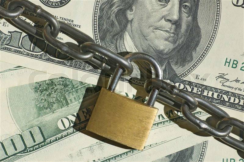 Financial security concept image one hundred dollars locked with padlock, stock photo