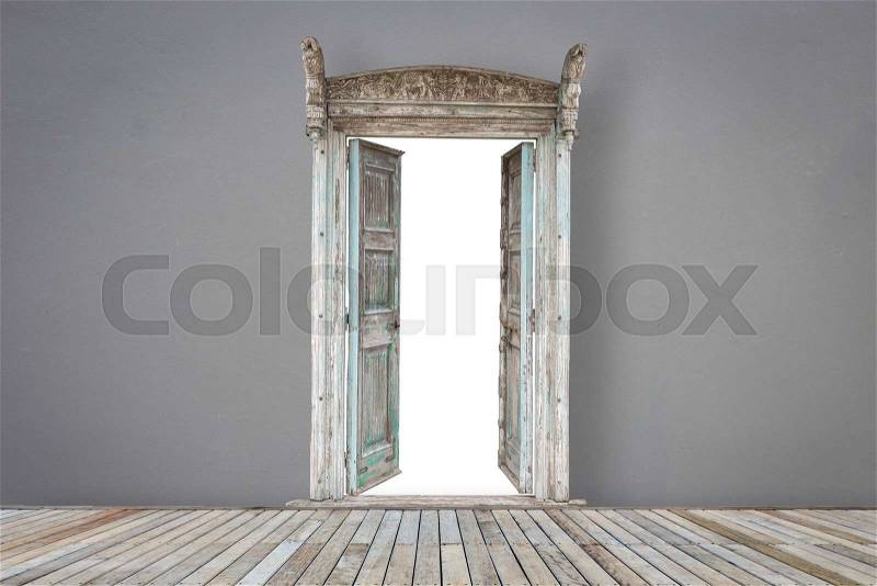 Retro style wooden door in grey color room with wooden decking, stock photo