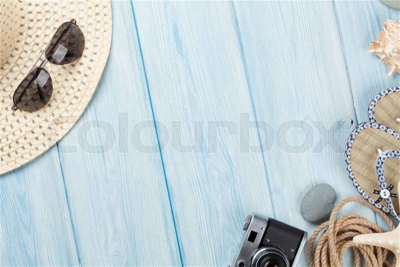 Travel and vacation items on wooden table. Top view with copy space, stock photo